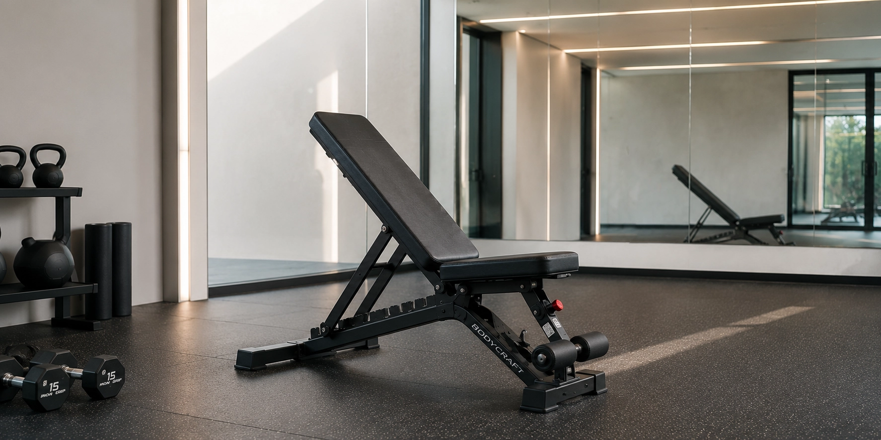 Adjustable Weight Benches Under 500 Adjustable weight bench in incline position with dumbbells in minimalist home gym