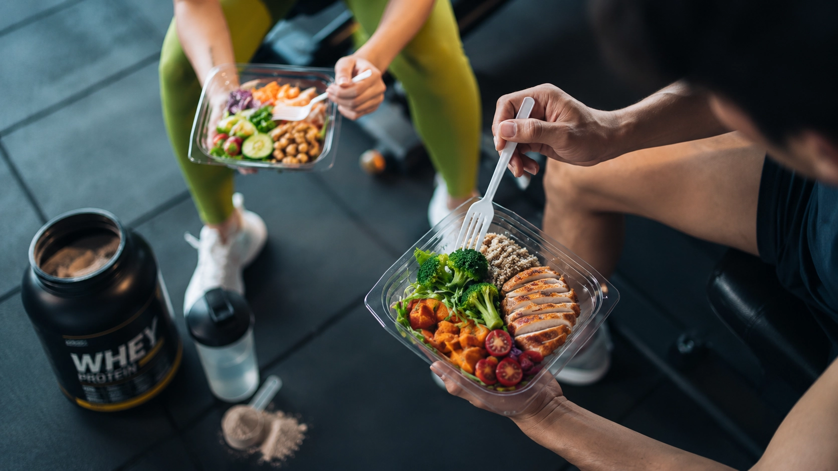 People preparing and eating nutritious meal-prep containers with grilled chicken, vegetables, and grains alongside whey protein powder