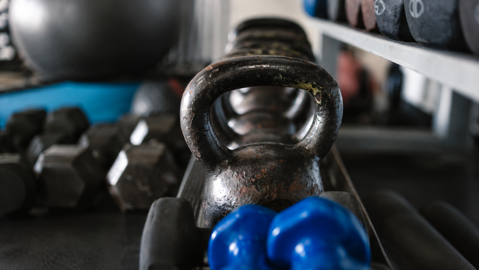 Dirty kettlebell with bacterial buildup and grime requiring cleaning and maintenance