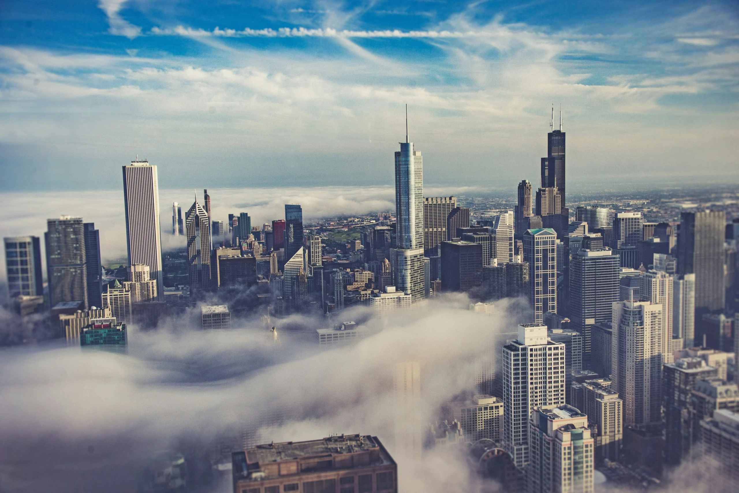GC seasonal care scaled City skyline with fog and mist representing humidity and temperature challenges in garage environments
