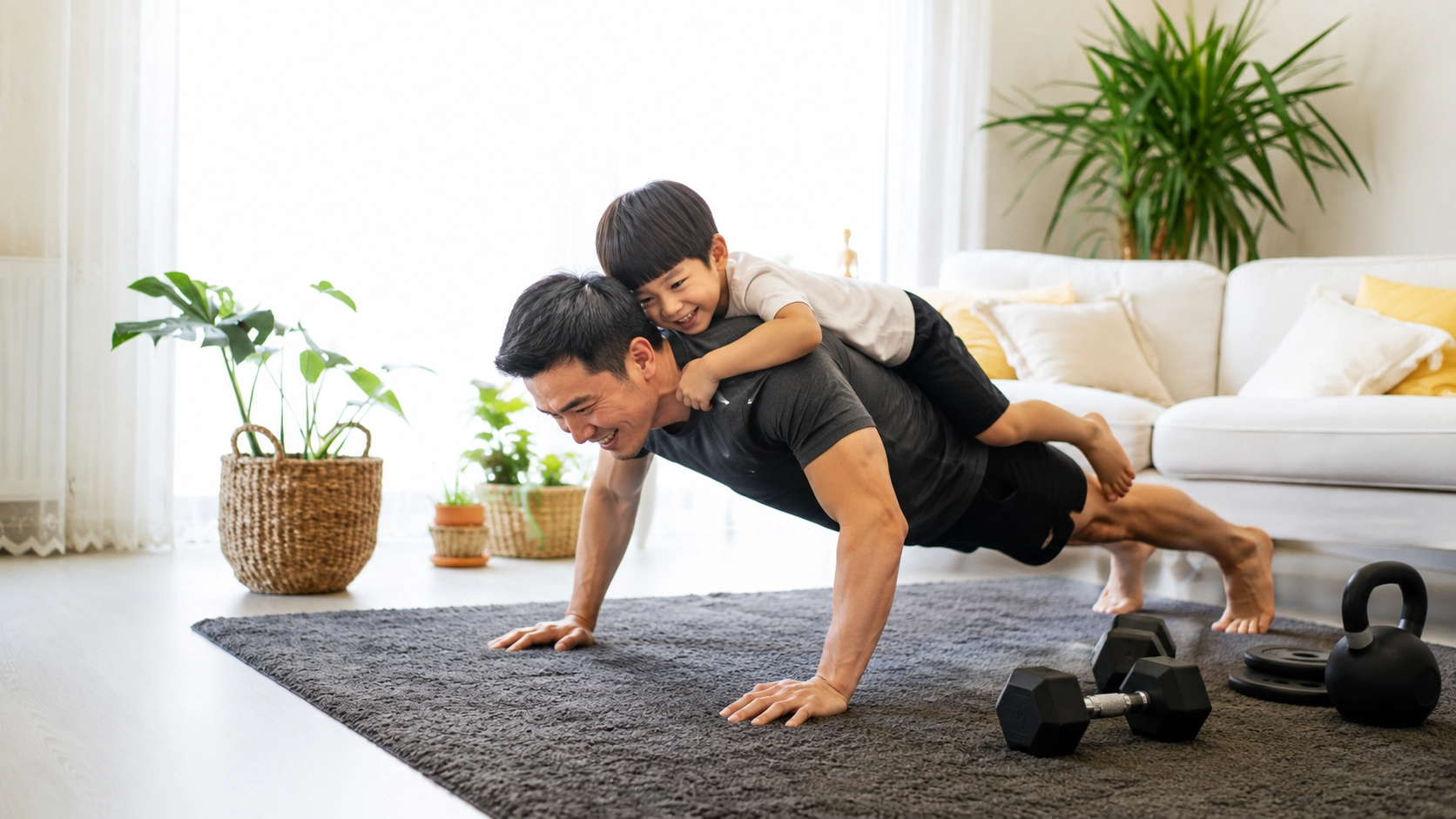 Father and young child doing a plank exercise together in a safe, family-friendly home gym with plants and dumbbells