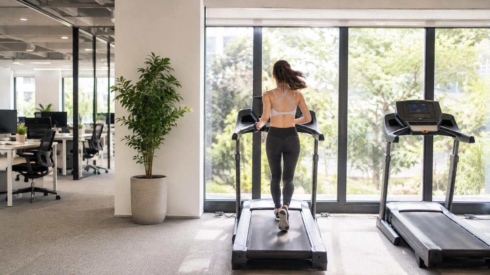 TM NordicTrack Woman running on NordicTrack treadmill with nature view in bright modern gym space