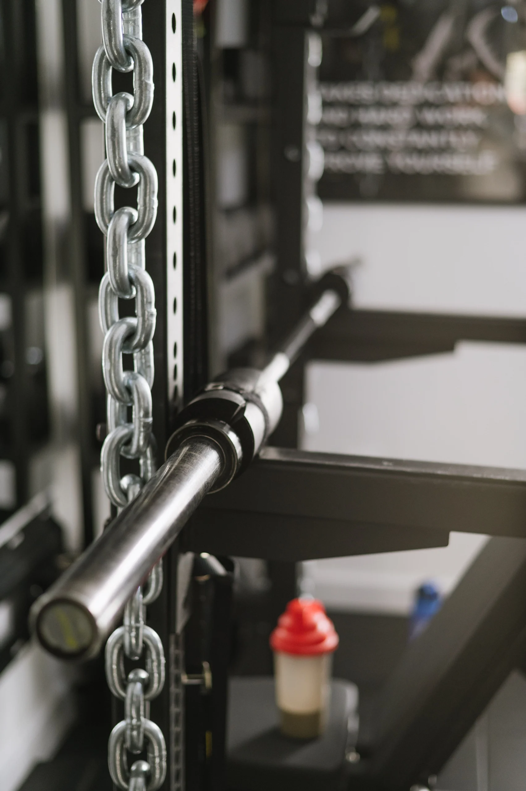 Barbell loaded on a power rack in a home gym setup