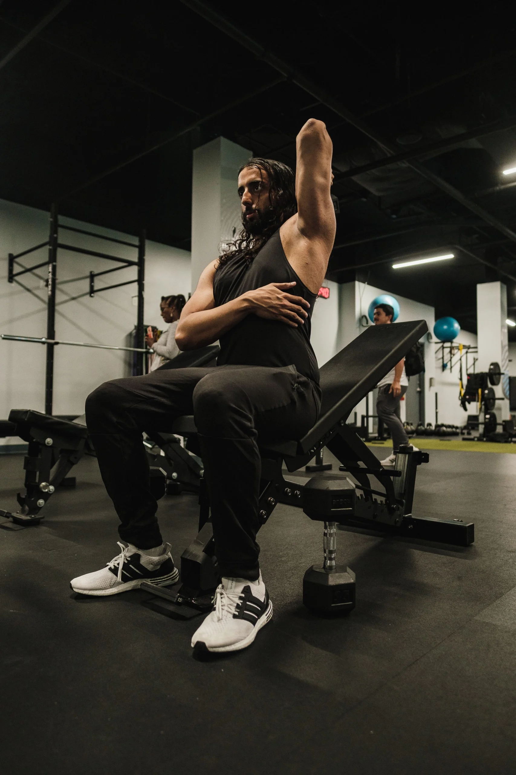 adjustable benches scaled Man performing ab exercises on adjustable weight bench in gym setting
