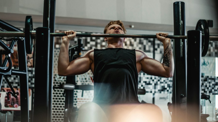 Athlete performing barbell squat in power rack with safety bars for strength training