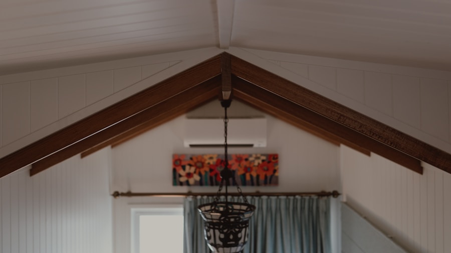 attic gym with exercise equipment arranged under sloped ceil Attic gym with exercise equipment arranged under sloped ceiling beams for home workouts