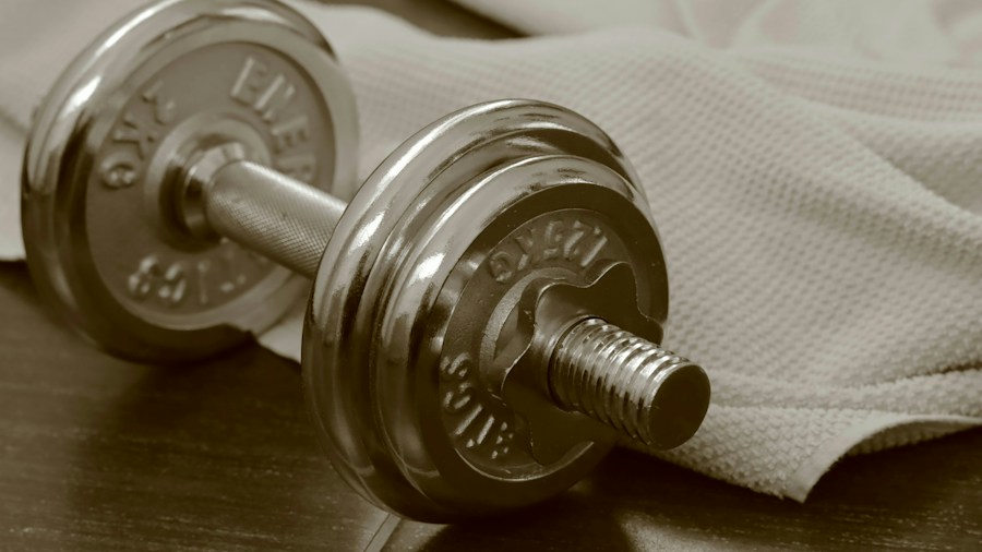 Close-up of damaged dumbbell coating showing wear and peeling from repeated use and poor maintenance