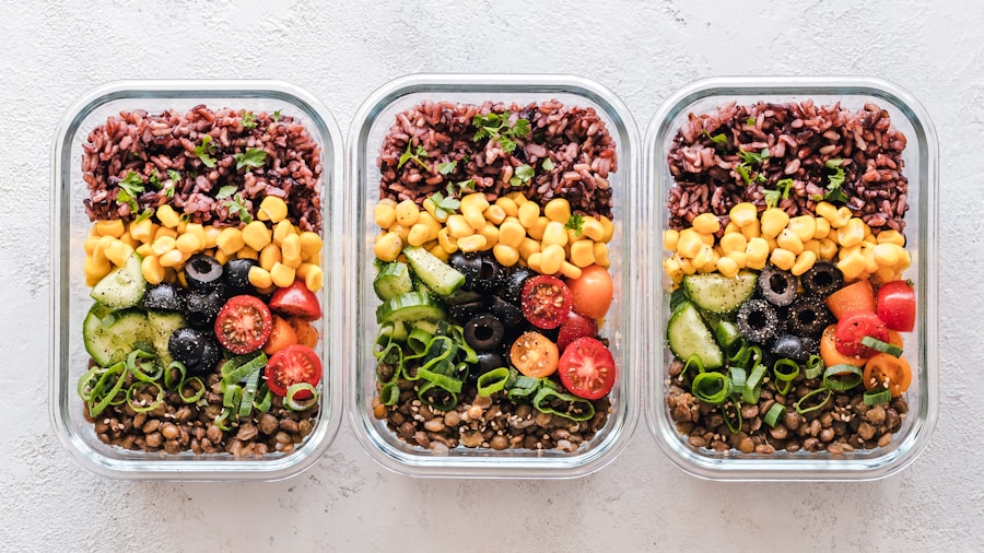 Meal prep containers with fresh vegetables and protein portions for weekly meal planning