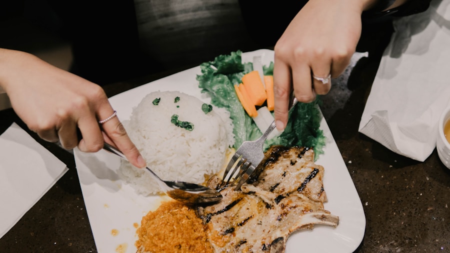 Person eating a chicken and rice bowl for post-HIIT recovery nutrition