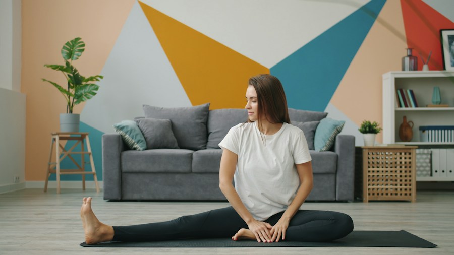 Person performing a stretch at home as part of a fitness routine