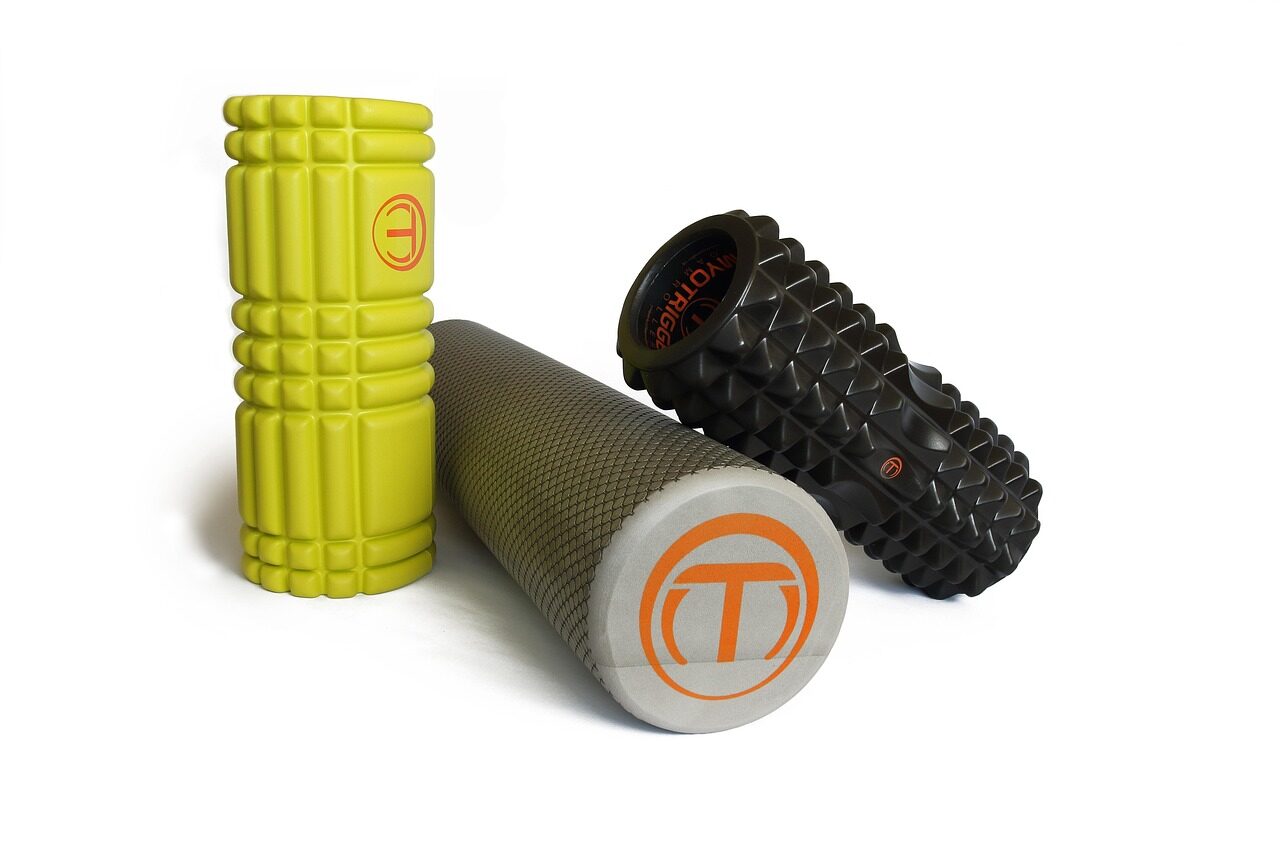 three foam rollers of different textures on a white backgrou Three foam rollers of different textures on a white background