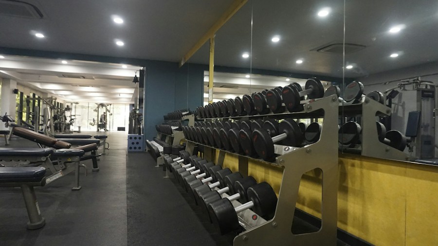 wall mounted dumbbell and kettlebell storage rack in organiz Wall-mounted dumbbell and kettlebell storage rack in organized home gym