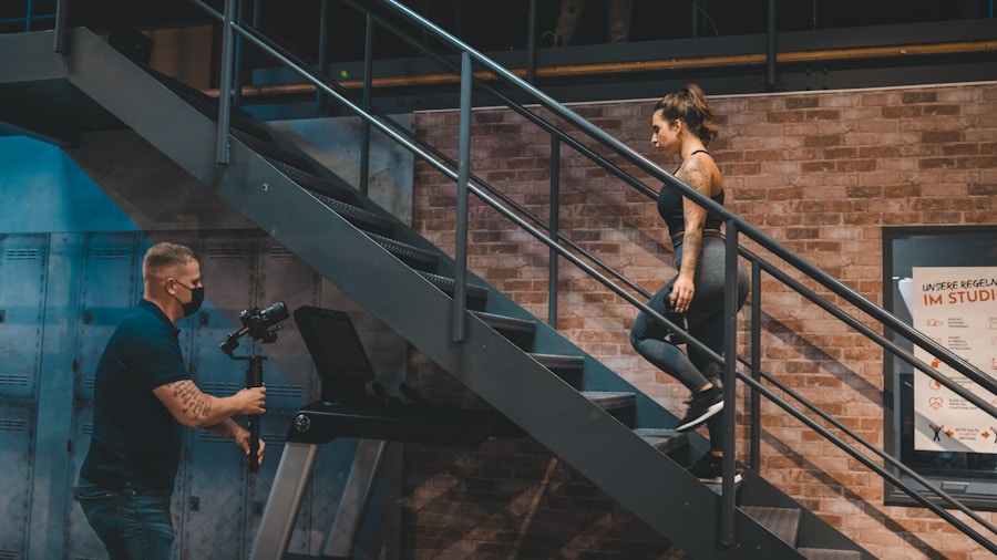 woman performing high intensity interval training on a stair Woman performing high-intensity interval training on a stair climber machine in home gym