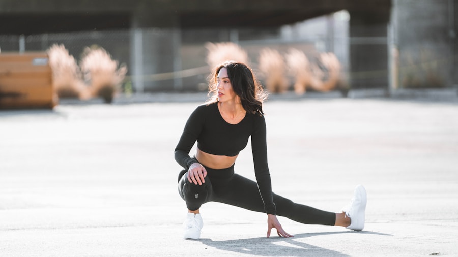 Woman performing seated leg stretches for recovery after exercise bike workout
